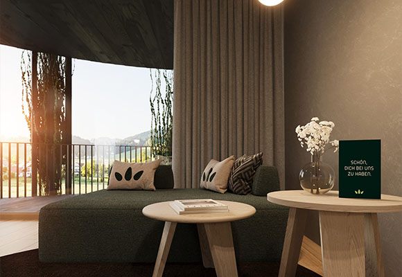 Einzelzimmer mit Bett, Sessel und Fernseher