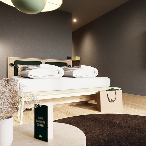 Modernes Doppelzimmer mit Bett und großem Raumgefühl