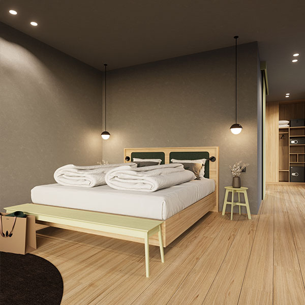 Moderne Juniorsuite mit Doppelbett und offenem Wohnbereich